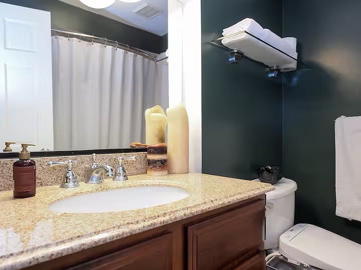 This is a bathroom! The bathroom features a bathtub, shower and a large granite-top vanity.
Shampoo, conditioner and shower gel are provided for your bathing convenience. Thats right: Youre worth it!