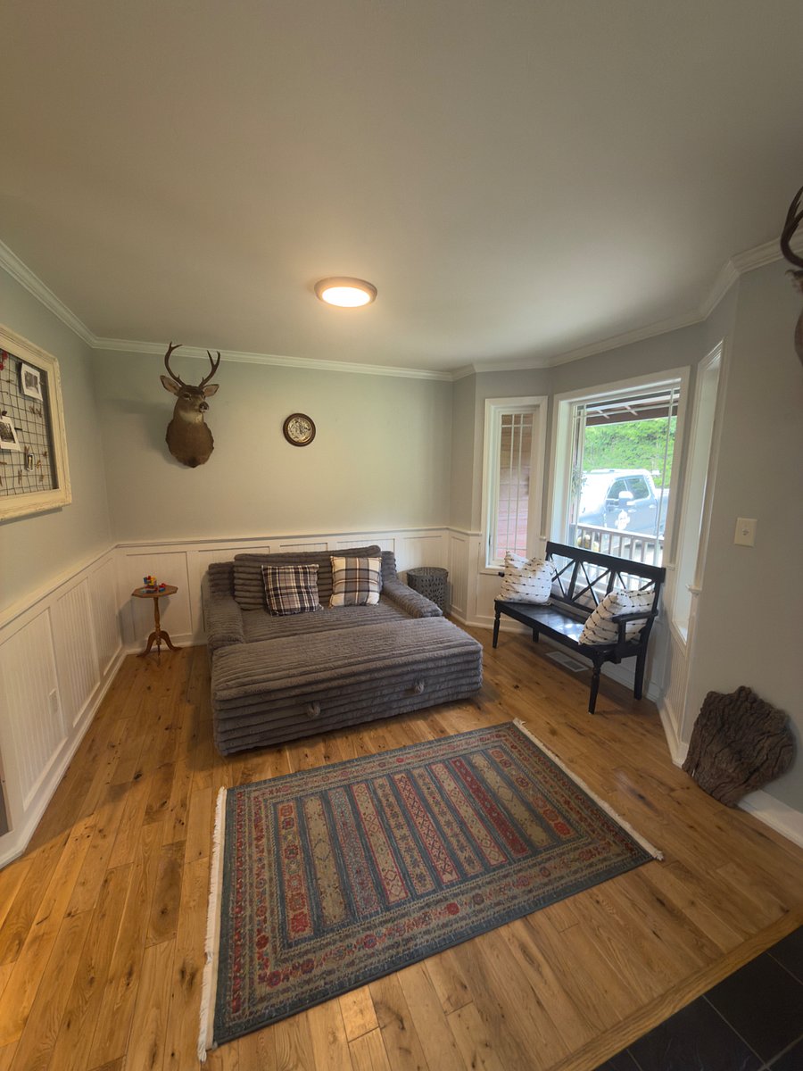 This love seat and ottoman may be made up into a bed for additional sleeping