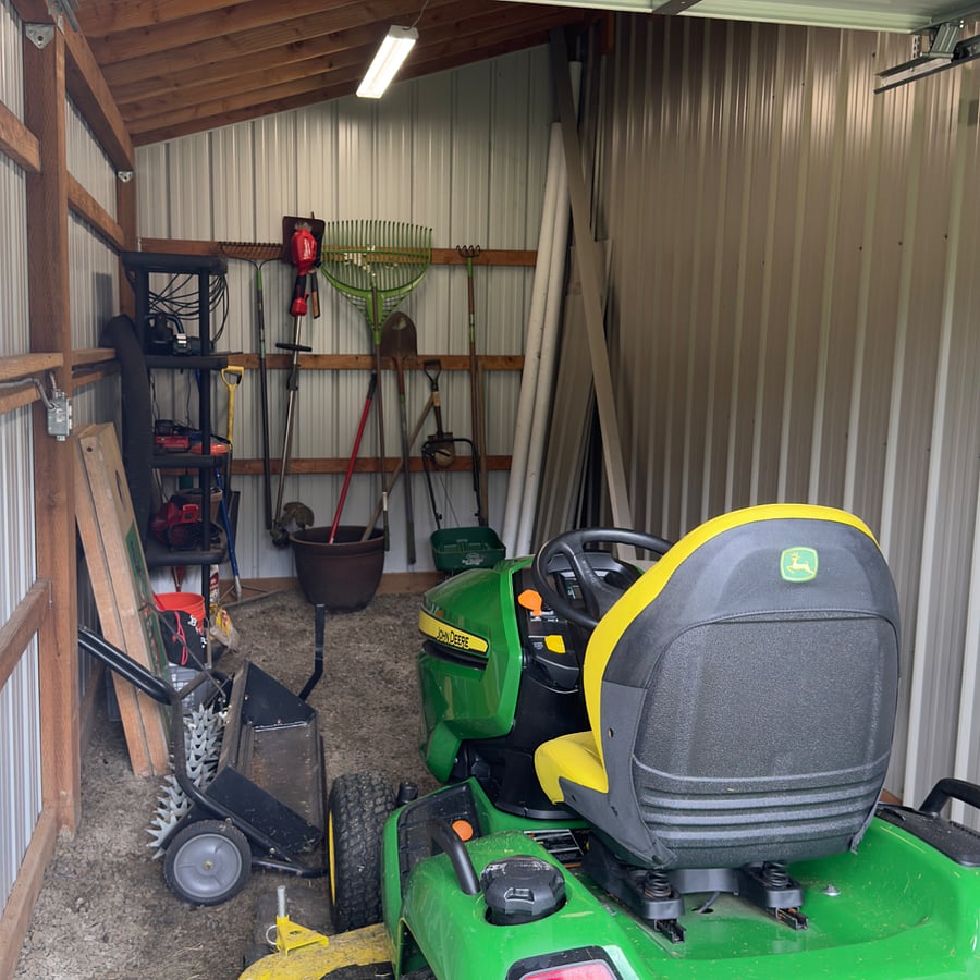 Lawn mower shed with tools