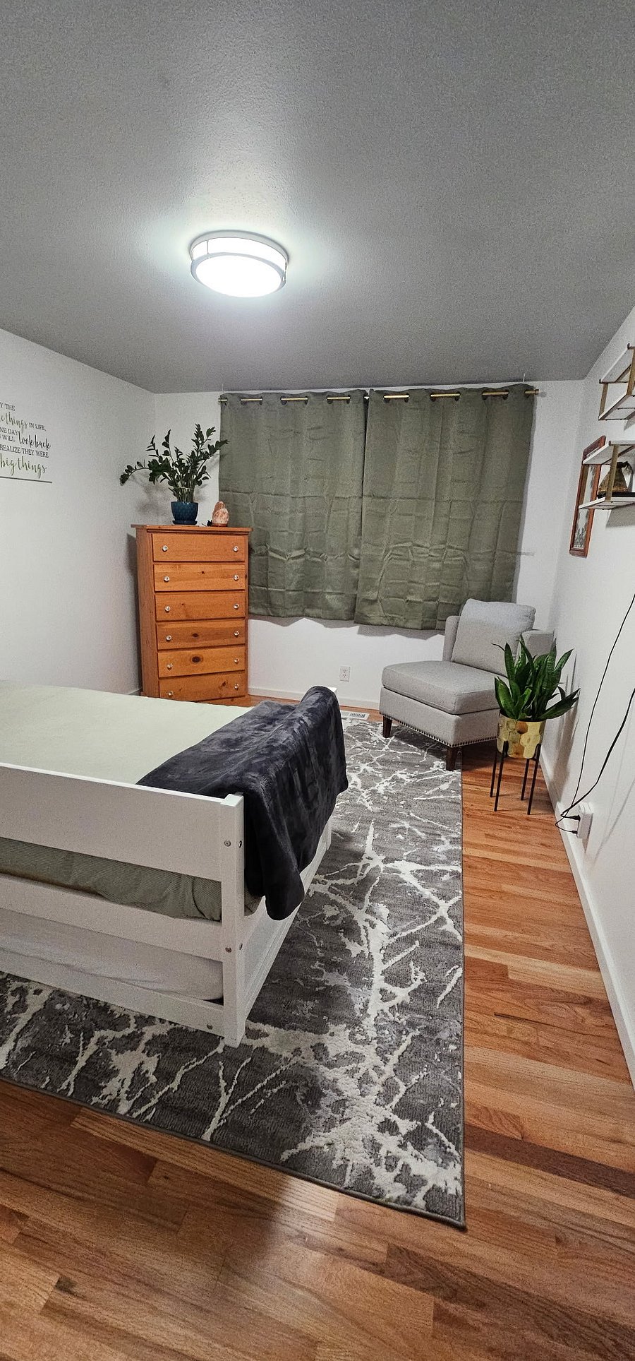 Unit B - Bedroom with twin daybed with trundle. Blackout curtains. TV, closet and dresser.