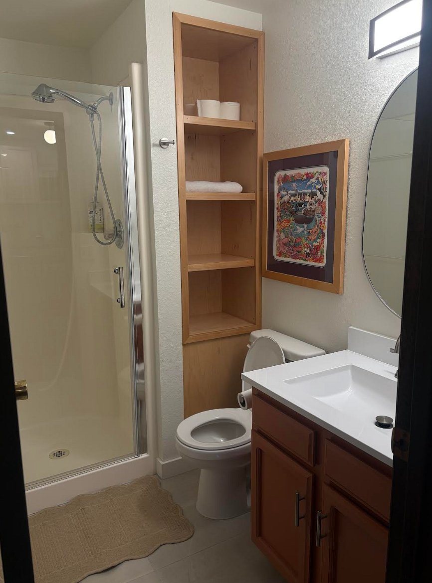 Bright, tidy bathroom with shower all essentials provided.
