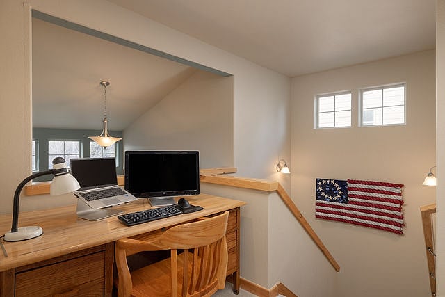 Upstairs work space with desk and monitor