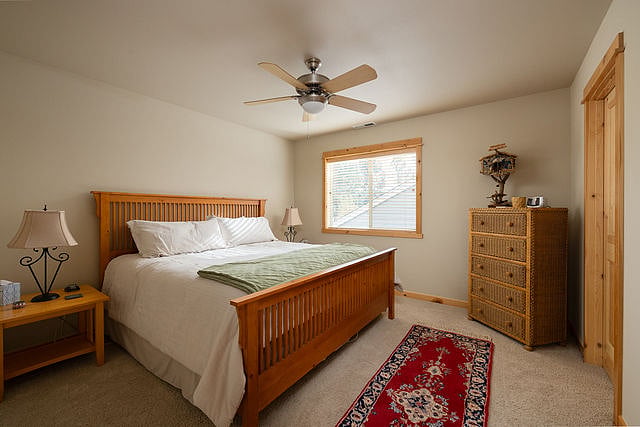 Upstairs bedroom with king bed and walk-in closet