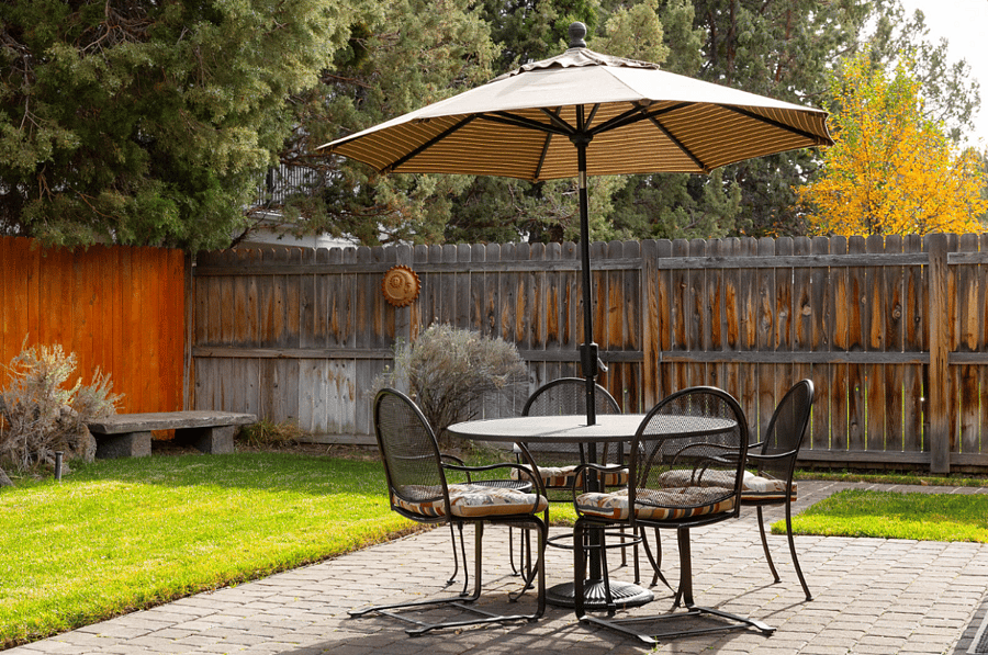 Back patio with fully fenced backyard
