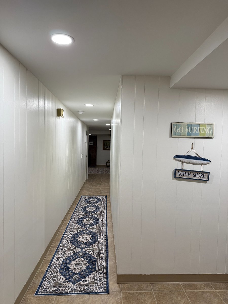 Bright hallway leading from kitchen to all additional rooms. 