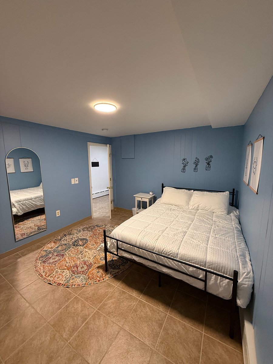 Welcoming and warm with full length dressing mirror.