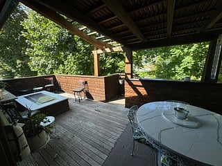 The deck offers a peaceful sense of living in a tree house!