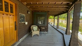 Your front door is accessed off of a covered boardwalk from the driveway, if you continue walking down the boardwalk, you find the back entrance to the apartment. 