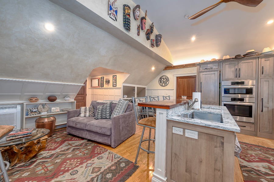 A vaulted barrel cathedral ceiling creates a spacious feel to the common areas. 