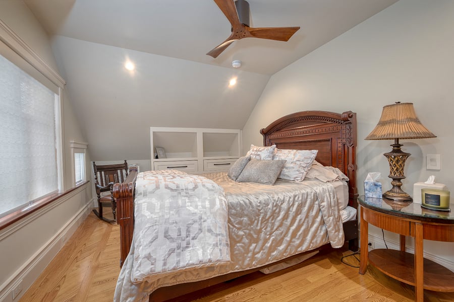 Off of the kitchen, find your beautiful bedroom with built-in shelves/drawer space. 