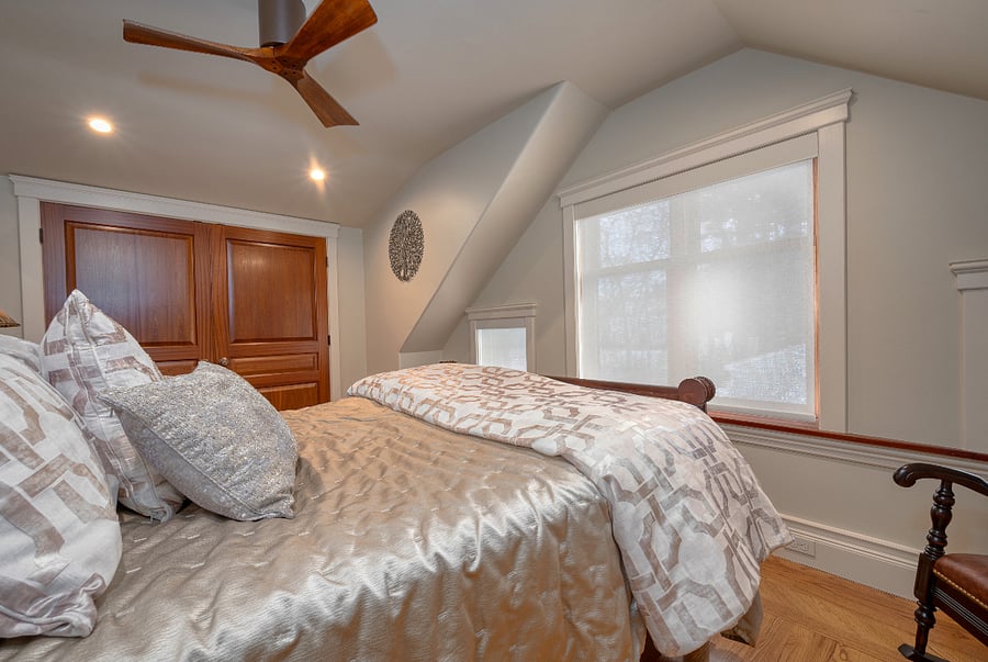 The bedroom looks out onto tranquil setting.