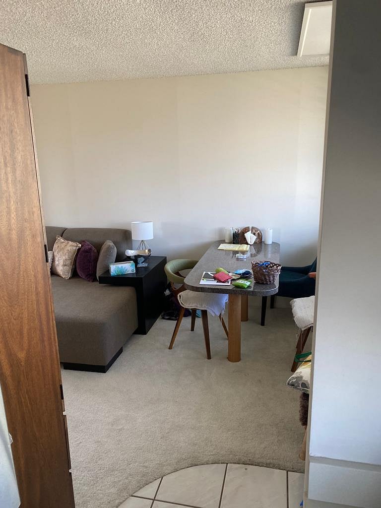looking from the kitchen and at the dining room and part of the living room.