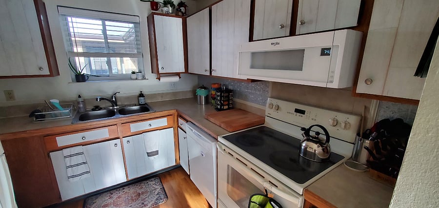 Kitchen includes microwave, stove, full size oven, and full size dishwasher