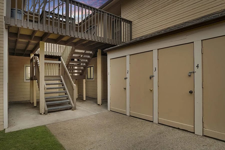 View of storage closet at bottom of stairs.