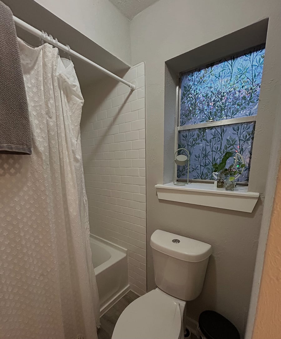 Master Bathroom with two in one shower heads and a nice privacy window that lets in natural light or fresh air.