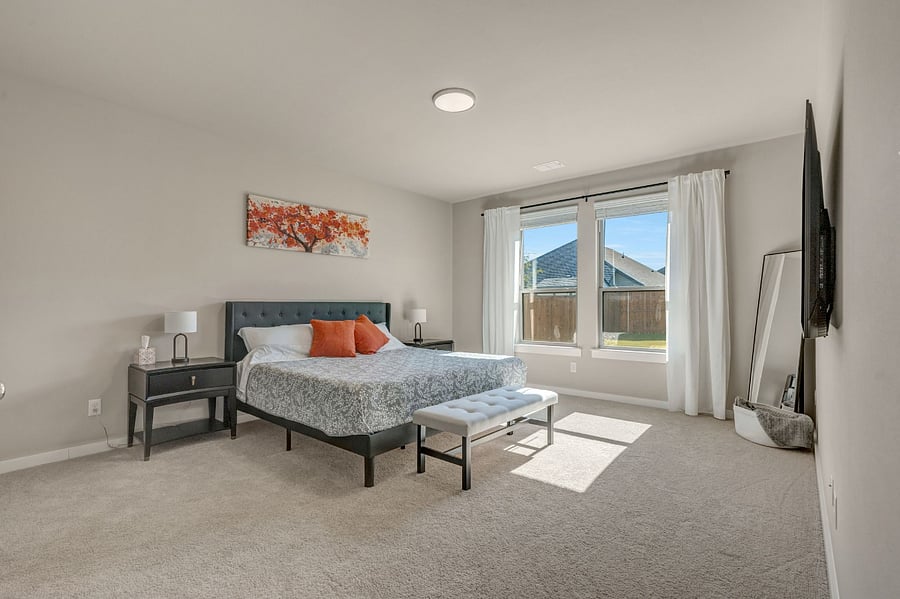 Main Floor -Master Bedroom Features a King Size Bed, Ensuite with a large walk in closet.and 65" Smart TV