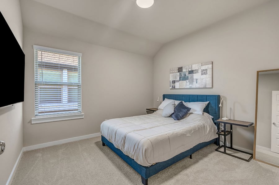 Guest Bedroom 2 (upstairs) features a queen size bed, dresser, closet, and 55" smart tv