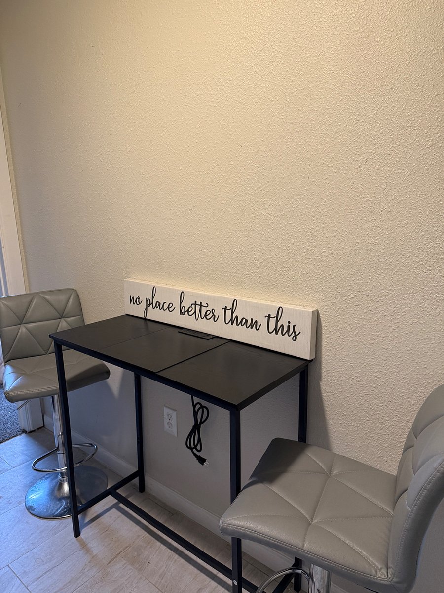 Dining area with electric powered table for convenience of charging/using devices.