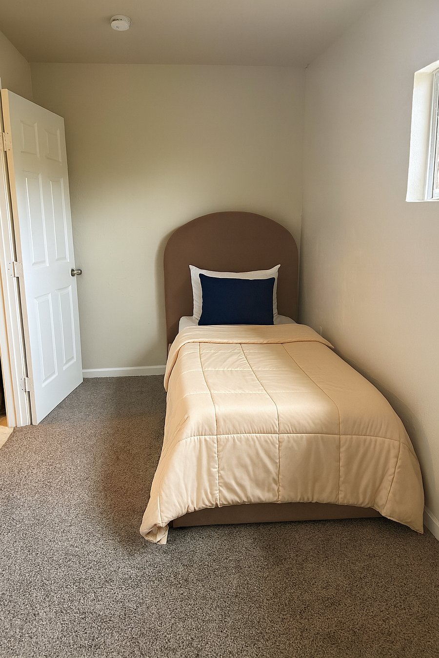 Master bedroom with new twin bed and mattress