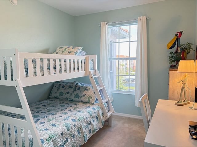 Guest room #3 with a twin bed over a full bed, desk, smart TV.