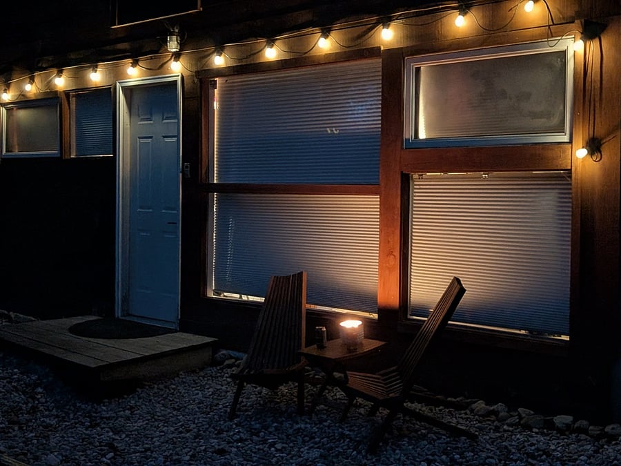 Slight overhang allows outdoor seating in mild weather. Solo firepit is on the patio