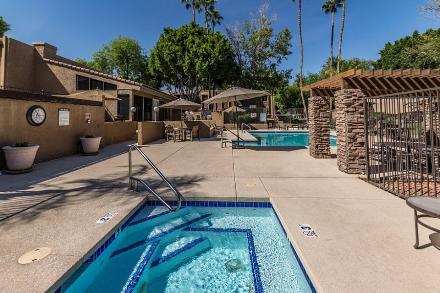 Hot tub beside pool area