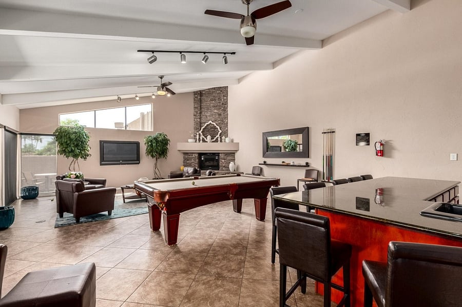 Clubhouse with seating, pool table, kitchen, workspace