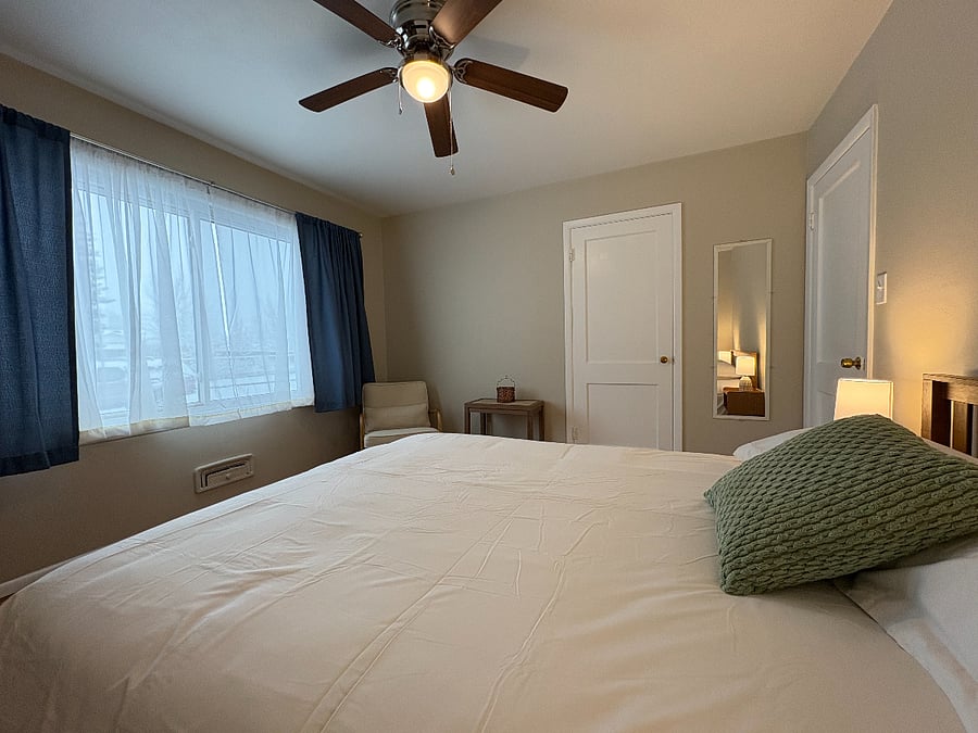 Bedroom 1 with shelving in closet. Largest bedroom.