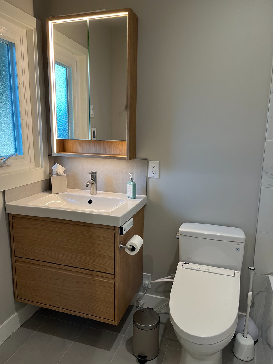 Heater floor, Toto bidet, a ton of storage in the deep medicine cabinet with warm light