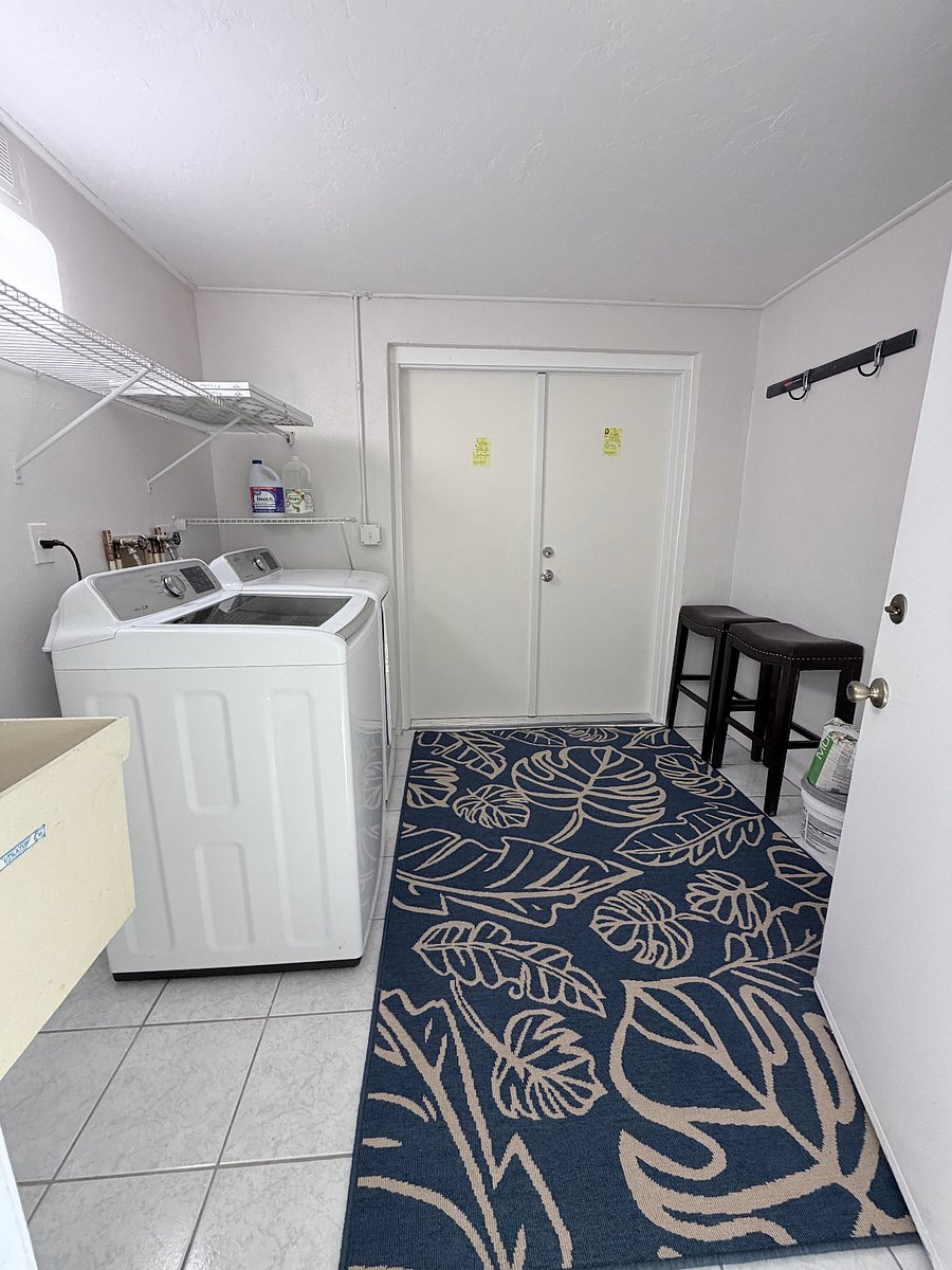 Laundry Room that leads to the carport.