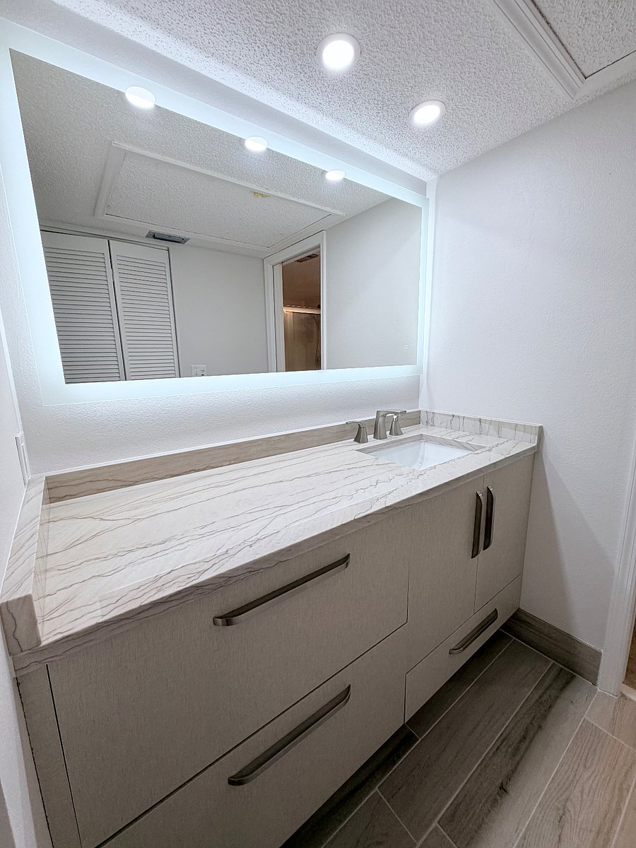 1 of the two master vanities with new LED lighting, cabinets and quartzite tops.