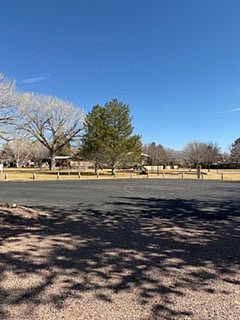 Private park across the street for your use. Including basketball court, ample green space, and play equipment.