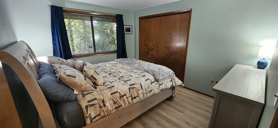 Downstairs bedroom #2. Queen size bed, blackout curtains, full closet, and 6 drawer dresser.