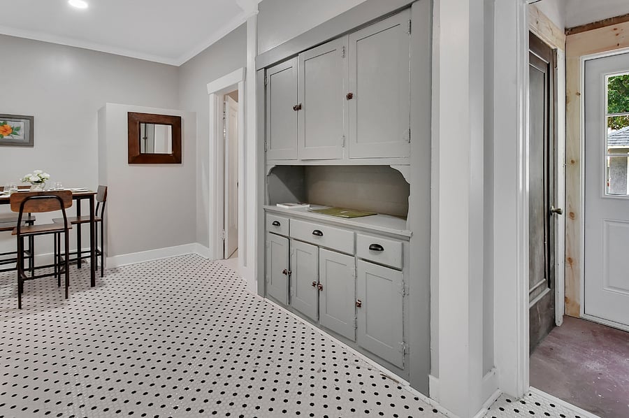Restored, historic built-in cabinetry and kitchen dining area