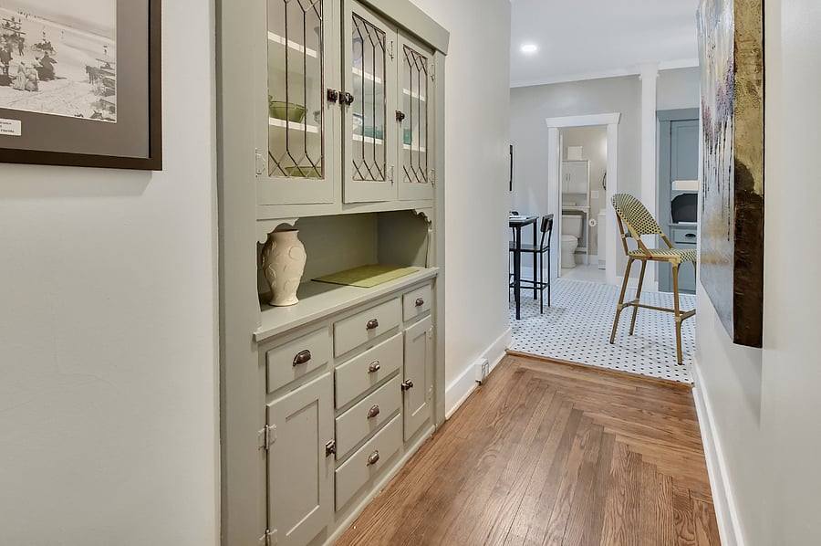 Hallway with restored, historic built-in cabinetry