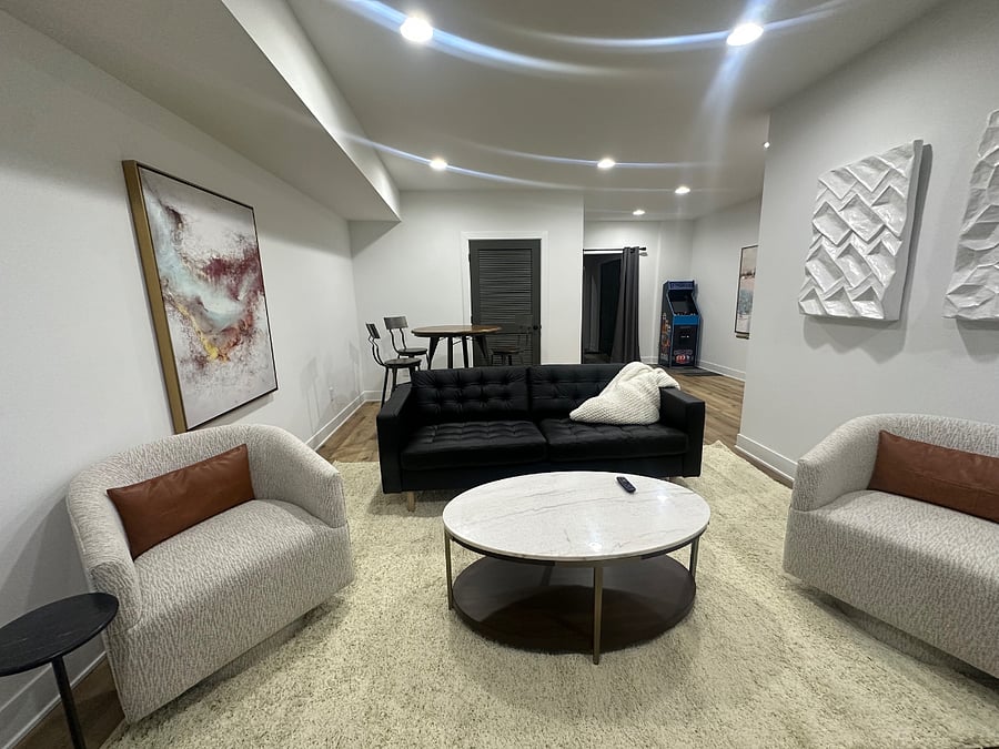 additional living room /tv with table and Pac man machine