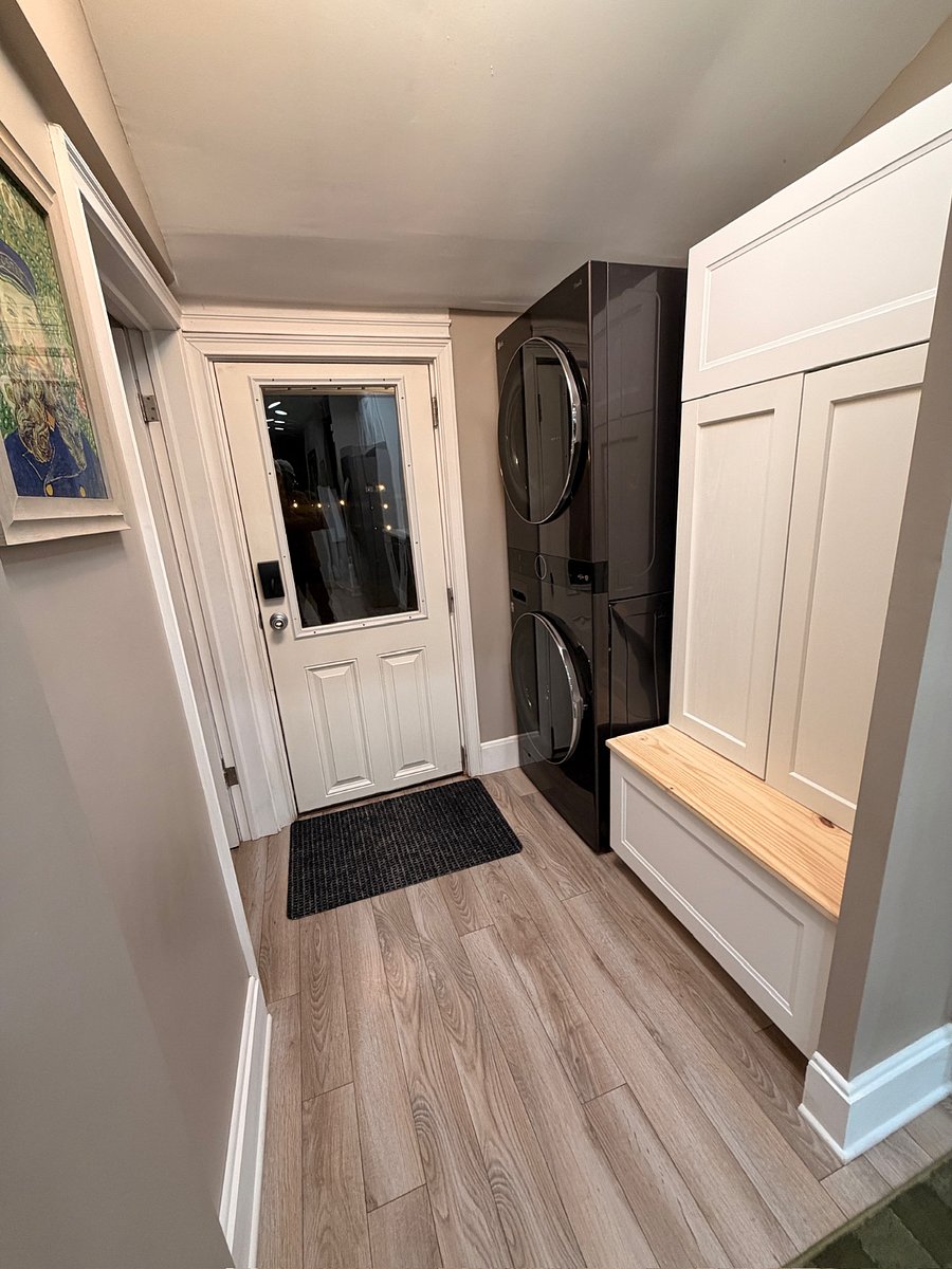 Washer, dryer, mudroom, and half bath leading into the backyard/garage area.