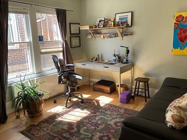 Second room upstairs set up as office with couch that doubles as guest bed