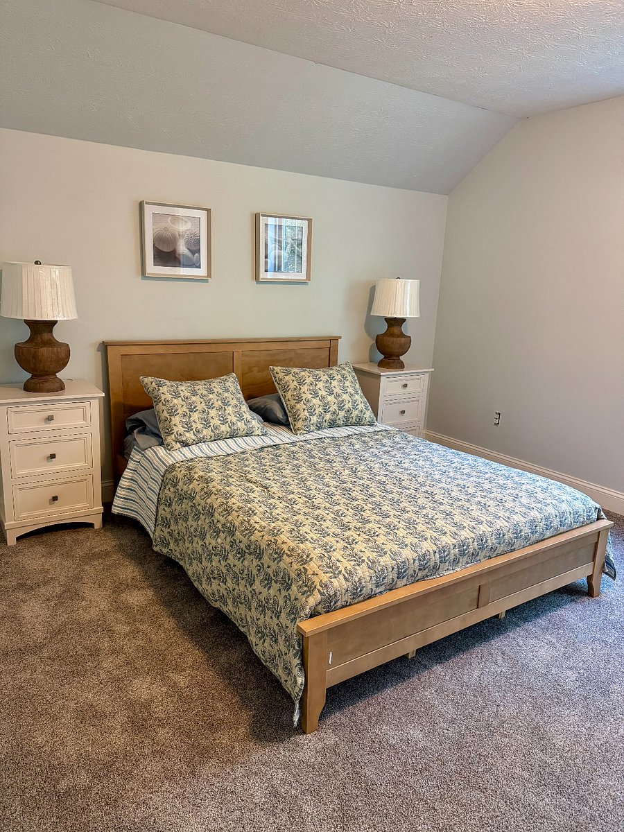 Master Bedroom with queen-size bed and attached private full bathroom.