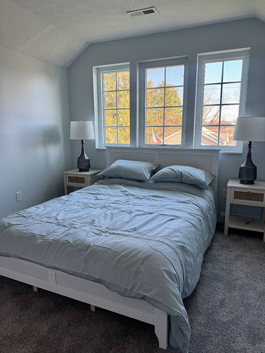 Second bathroom with queen size bed, dresser, and closet.