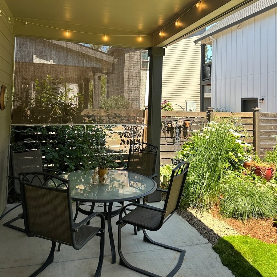 Back patio w/table, chairs & privacy screens ~