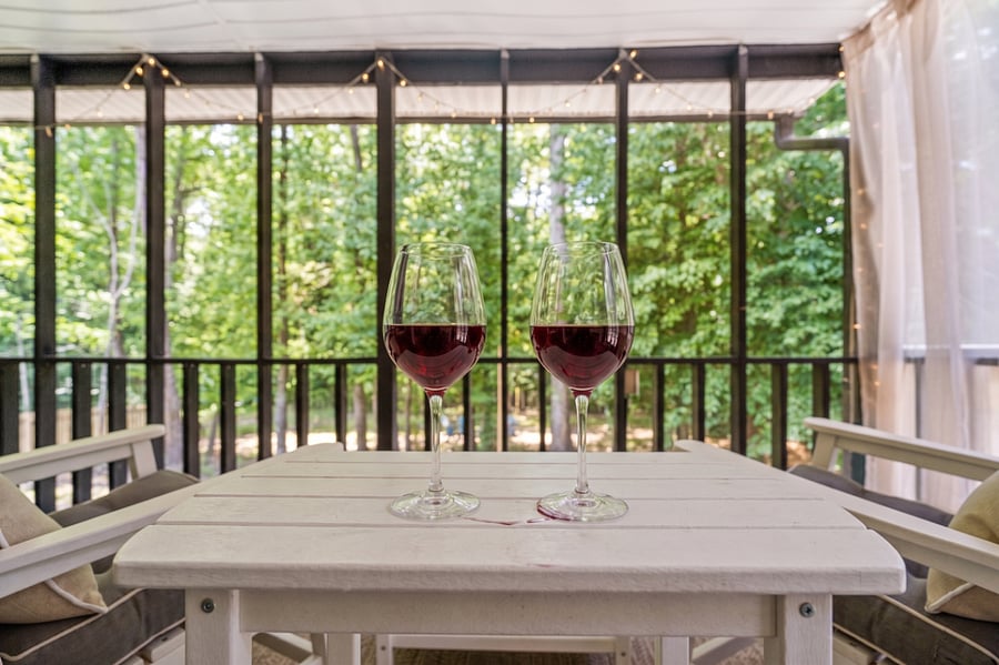 Relax on thick cushioned chairs overlooking the yard.