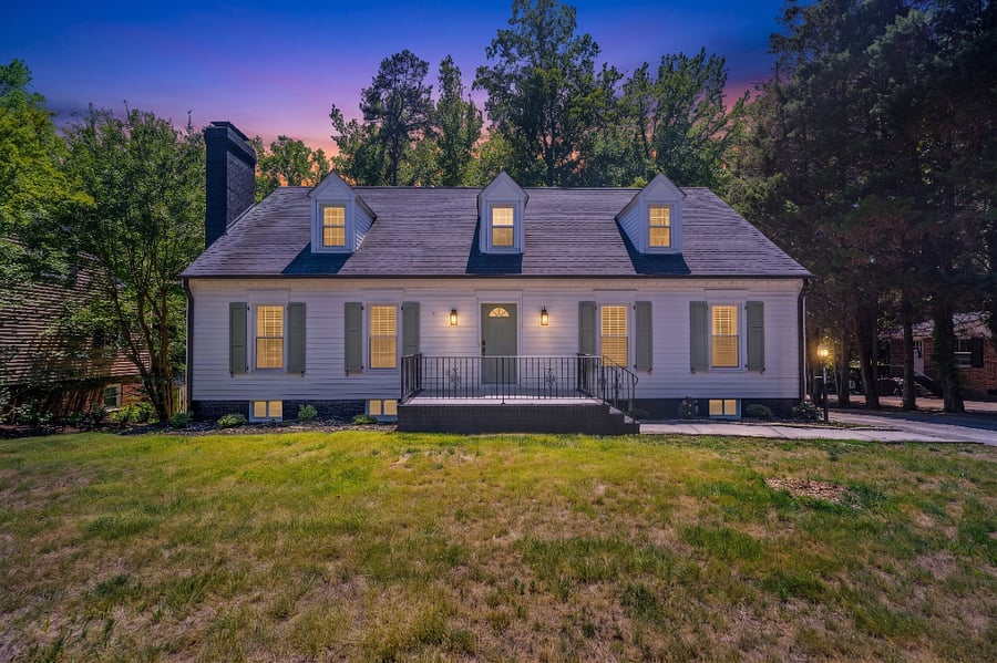 Front of house at night.