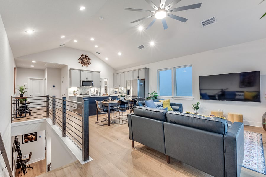 "Great Room" open concept with kitchen, living room and dining room all sharing a 15' vaulted ceiling.