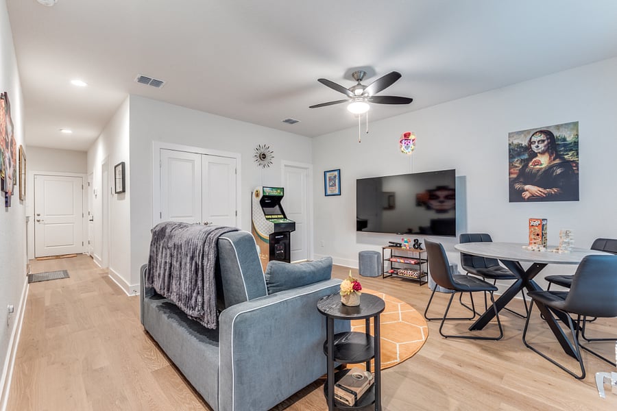 1st floor gameroom / extra bedroom. Couch quickly pulls out to a queen sized Serta sleeper. Multiple board and card games as well as a Golden Tee console and a 75" SmartTV.