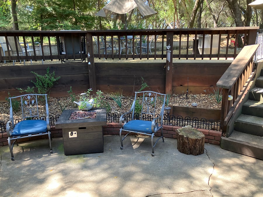 Lower patio with firepit and stairs to upper patio. (Gate at stairway has been installed-not shown in photos.)