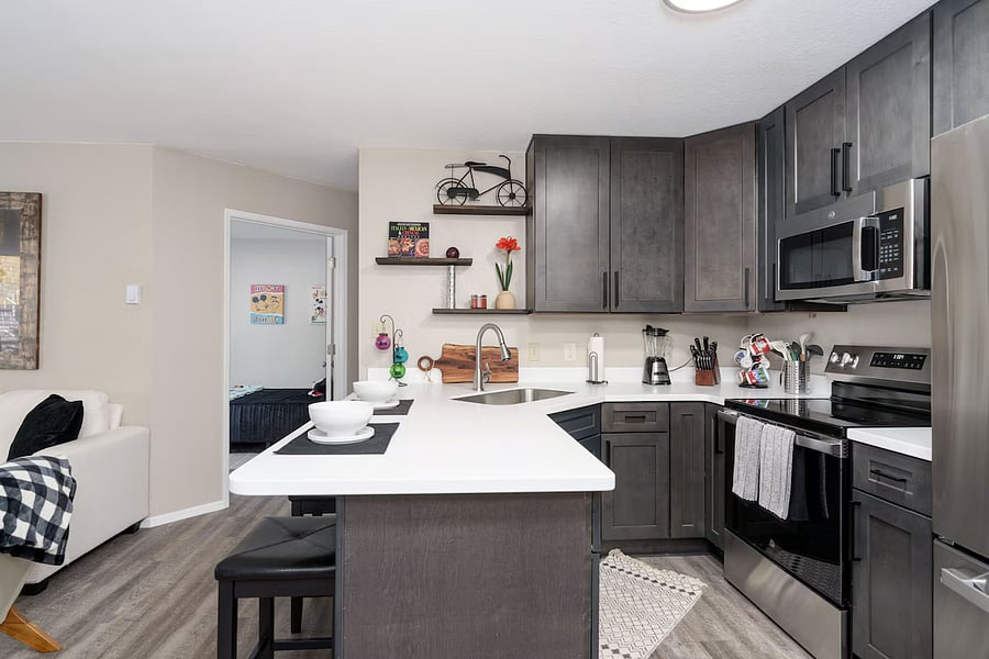 Full kitchen with dishwasher oven and microwave