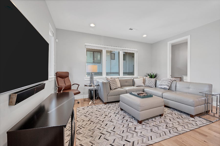 Second Floor: living room w/ 65in. smart tv and soundbar
