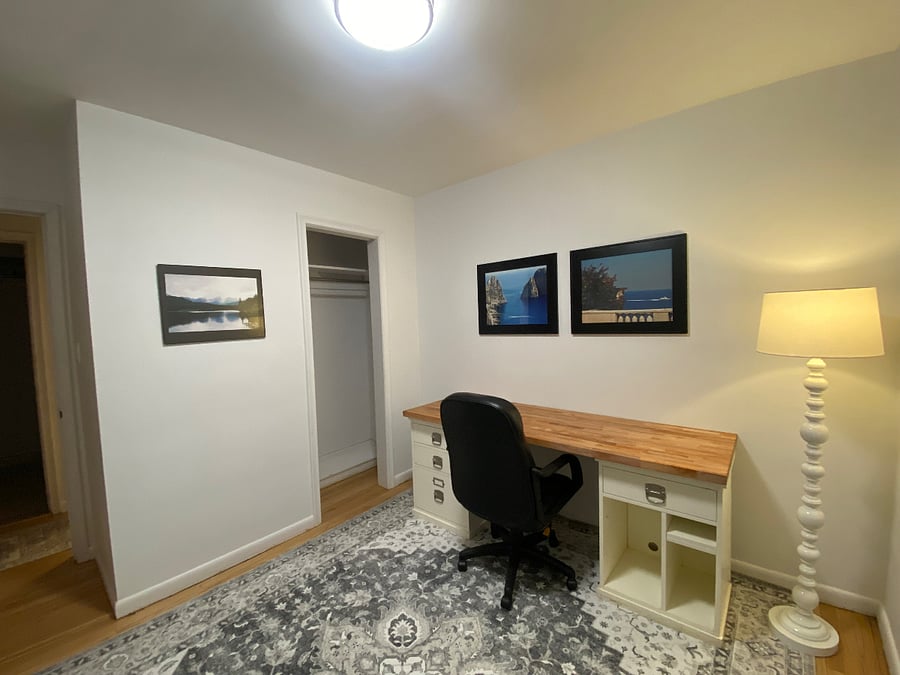 Home Office - it was the third bedroom. Large desk all set up and ready for you to get your work done! Hardwood floors. Blackout curtains.