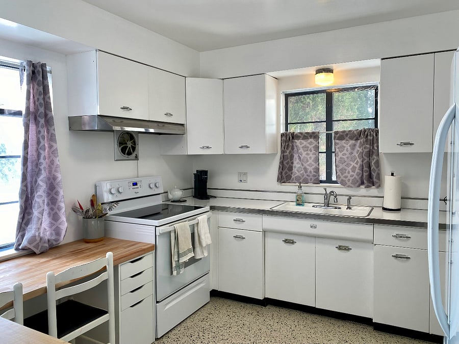 Kitchen- Vintage 1950 metal cabinetry! Freshly repainted and countertops just resurfaced. New butcher block eating area. Well outfitted with quality appliances and cookware - a mix of vintage and new.